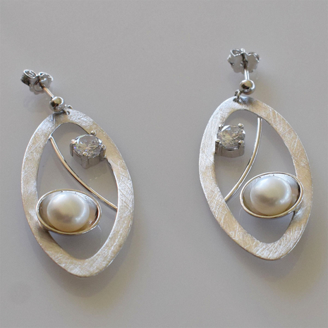 Handmade sterling silver earrings 925o oval with mat silver plating and white pearls and white zirconia IJ-020115A Image 4 in natural environment without special lighting